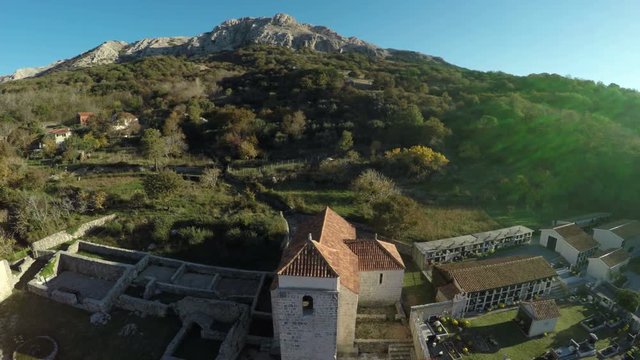 Church and a mountain in Baska, aerial view