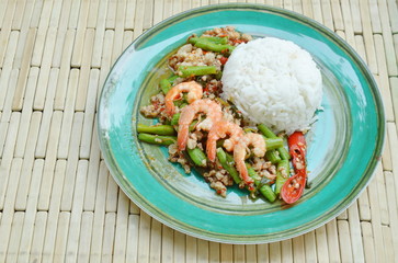 spicy stir fried minced pork and shrimp with basil leaf on rice