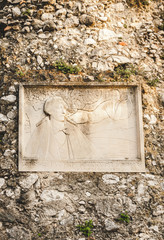Memorial plate on old  stone wall in Castle Hill park in Nice, Cote d'Azur, France