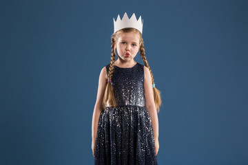 Young girl in princess costume sending kiss