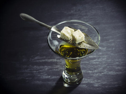 Glass of Absinthe with traditional spoon