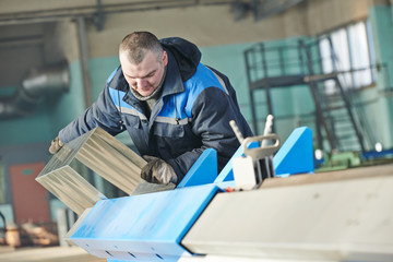 Sheet metal folding. industrial worker works with detail at bending machine