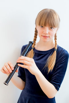Girl playing on a flute