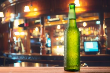 Fotobehang Bottle of beer on the bar © olegkruglyak3