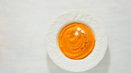 pumpkin soup puree in the white plate