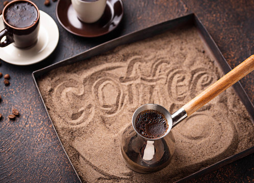 Traditional turkish coffee prepared on hot sand
