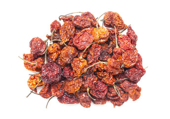 top view dried carolina reaper peppers on white background