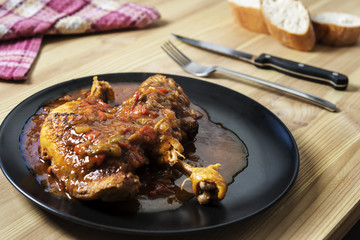 traditional chicken dish with vegetables in sauce