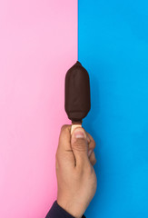 hand holding a chocolate and mint ice cream.