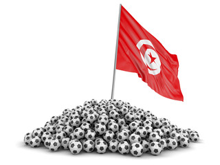 Pile of Soccer footballs and Tunisian flag. Image with clipping path