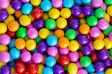 Fototapeta na wymiar Background texture of rainbow colored sugar candy