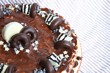 Traditional cake three chocolates. Mousse glaze darkness decoration cake.