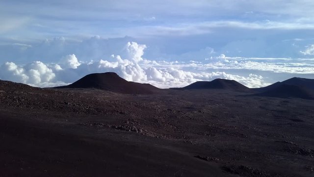 Sunrise clouds over the peak of Mauna Kea mountain, Hawaii. USA