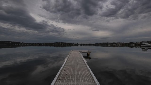 Time lapse of clouds rolling over a dock in lake Macquarie Australia