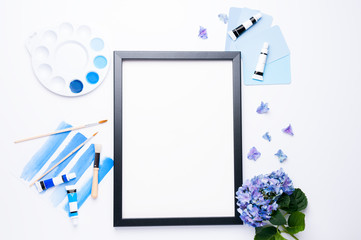 Picture frame mock up styled with watercolor artist's tools