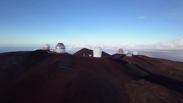 Flying around the Mauna Kea Observatory summit in the morning, Hawaii. USA