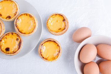 Top view of egg tart with egg. Portugal Egg Tart
