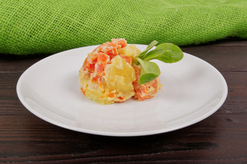 Cream potatoes with vegetables on a table