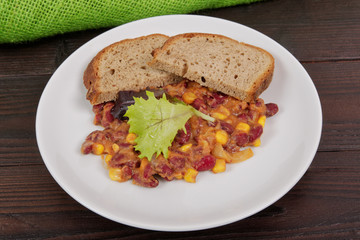 Cowboy beans with bread on a table