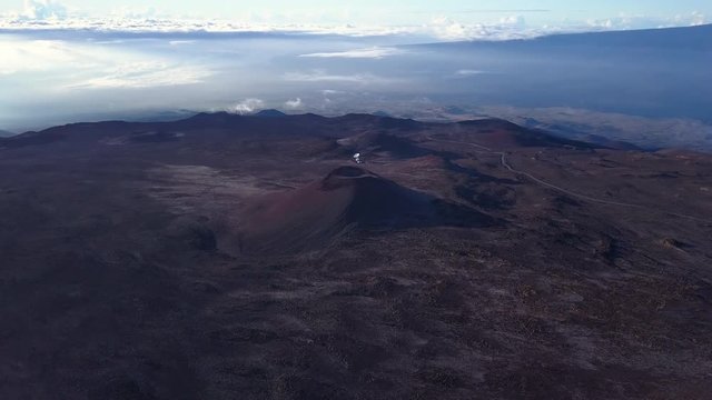 Flying around dormant volcano of summit of Mauna Kea mountain, Hawaii. USA