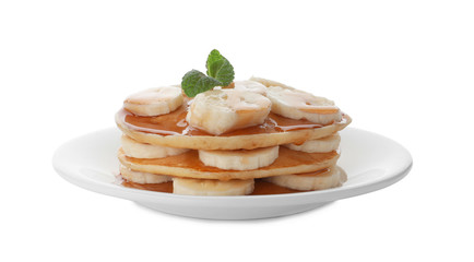 Plate with delicious pancakes on white background