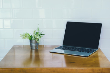 empty computer laptop with highlight pen on table in coffee shop with copy space. freelance concept, still holiday concept, relax working concept. digital technology.