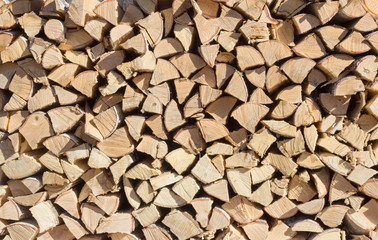 chipped birch wood are stacked in a log, preparation for winter