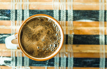 cup of coffee photographed from above, coffee background