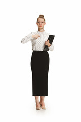 Full length portrait of a female teacher holding a folder isolated against white background