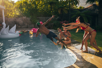 Friends enjoy pool party in summertime