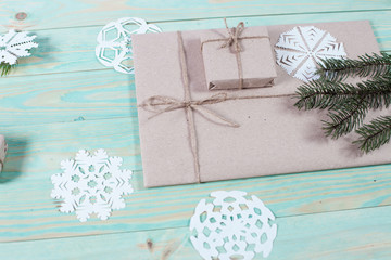 Gift boxes wrapped kraft paper tied with twine and paper snowflake and tied with twine. with copy space