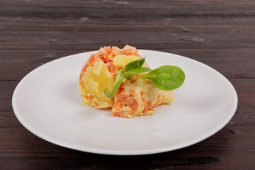 Cream potatoes with vegetables on a table