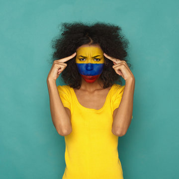 Young Woman With Columbia Flag Painted On Her Face