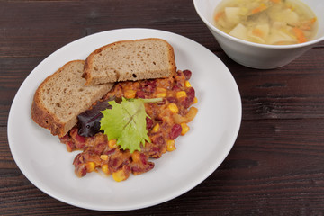 Cowboy beans with bread on a table