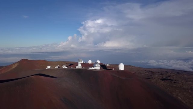 Morning sun over the Mauna Kea Observatory, aerial view. Hawaii, USA