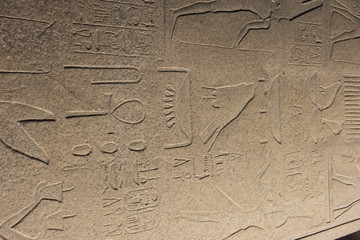 Ancient egyptian obelisk on side in Karnak temple at night