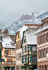 Obraz premium Houses in Ribeauville and the Saint Ulrich Castle in the Vosges Mountains. Alsace, France