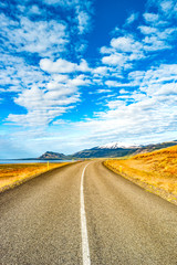 Isolated road and Icelandic colorful landscape at Iceland,
