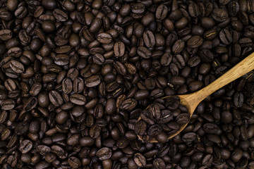 coffee bean background with wooden spoon