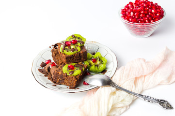 Chocolate cake with kiwi and pomegranate