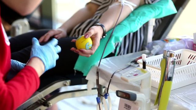 Blood donator donates blood in the hospital
