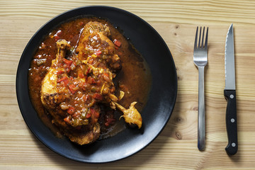 chicken dish with vegetables in sauce