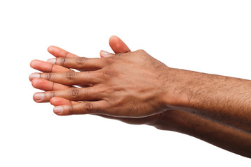 Black man applying hand cream at white isolated background