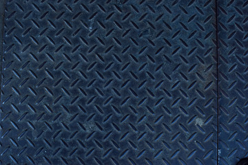 Urban diamond plate closeup texture background.