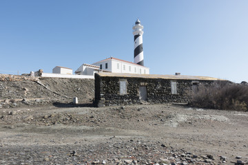 Lighthouse on the slate cape of Favaritx, Menorca, Balearic Islands, Spain