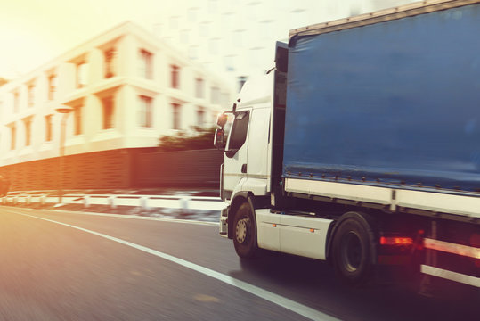 Fast Truck On A City Road Delivering