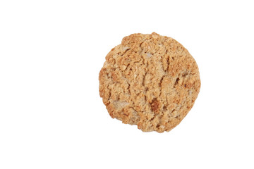 One healthy vegan integral cookie made from hazelnut powder & linseed isolated on white background. Single home made vegetarian sugarless & gluten free snack with nuts. Close up, copy space, top view.