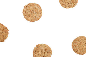 Fototapeta na wymiar Bunch of healthy vegan integral cookies made of hazelnut powder & linseed isolated on white background. Home made vegetarian sugarless & gluten free snack with nuts. Close up, copy space, top view.