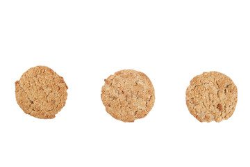 Bunch of healthy vegan integral cookies made of hazelnut powder & linseed isolated on white background. Home made vegetarian sugarless & gluten free snack with nuts. Close up, copy space, top view.