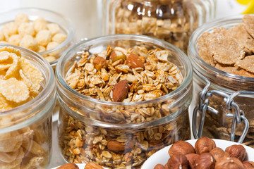 assortment of breakfast cereals and nuts, closeup